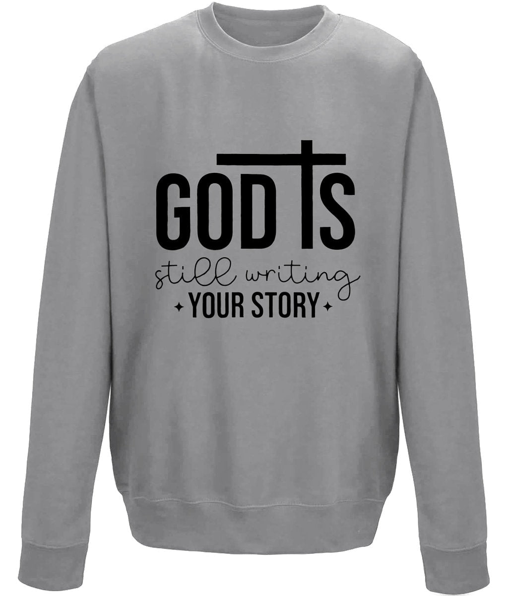 God Is Still Writing Your Story unisexsweatshirt - BoundlessLoveStore - X-Small - Graphite Heather - Christian Sweatshirt